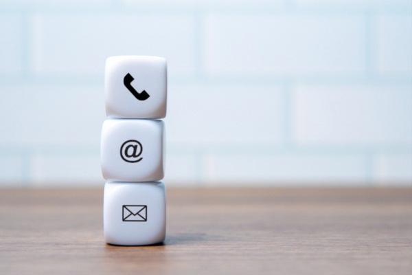 contact icons on plastic dice on top of each other depicting Why Reach Out To A Professional Insulation Company