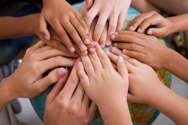 image of kids holding earth depicting the importance of energy efficient insulation