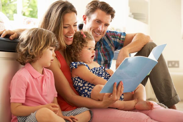 happy family in summer staying cool with a whole house fan