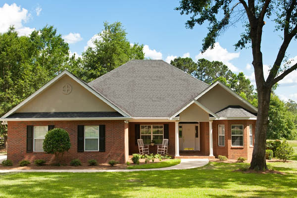 image of a brick house depicting adding insulation to existing walls