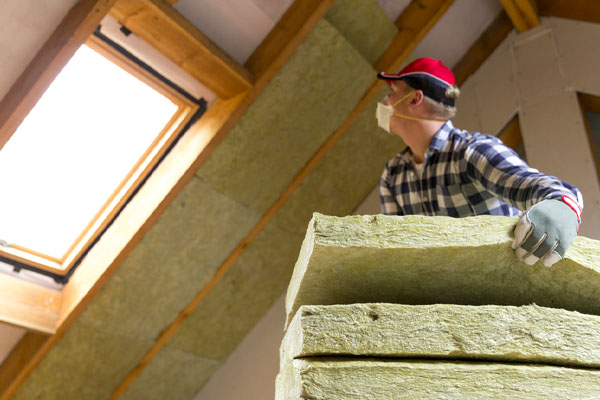 image of an insulation contractor reinsulating house