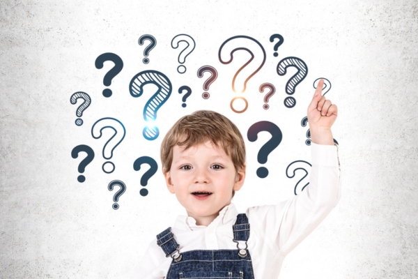 kid with left point finger raised up with question marks in the background depicting FAQs about paint foam insulation