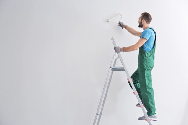 professional painter painting insulation using proper techniques