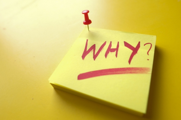 why written on a sticky note pinned on a yellow board depicting painting foam insulation in Colorado