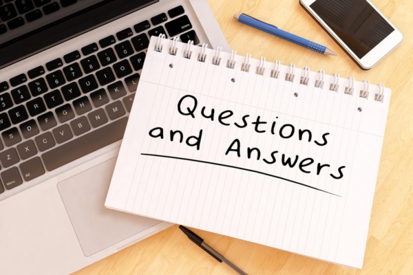 Questions and Answers text handwritten on a notebook depicting FAQs about insulation