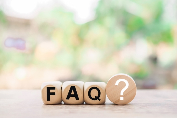 FAQ spelled using wooden letter dice depicting questions about wall insulation