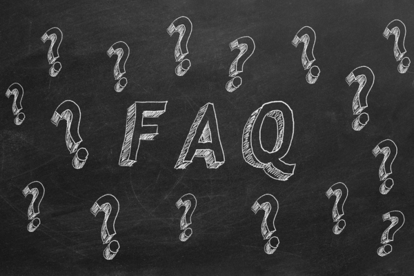 FAQ written on a chalkboard surrounded by question mark doodles depicting questions about insulation & air sealing
