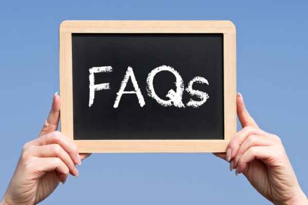 FAQs written on a mini chalkboard depicting questions about Spray Foam Insulation Installation