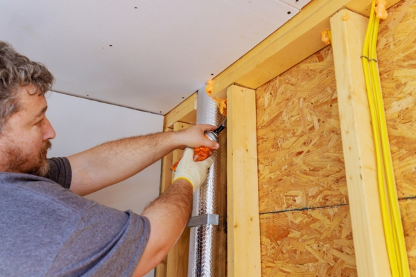 worker air sealing home insulation