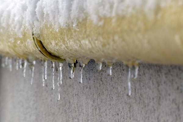 frozen pipes with icicles