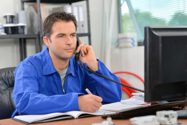 insulation expert answering a call from a customer