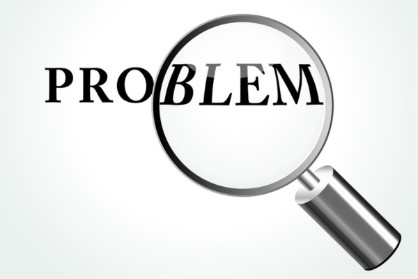 problem word highlighted by magnifying glass depicting fiberglass insulation