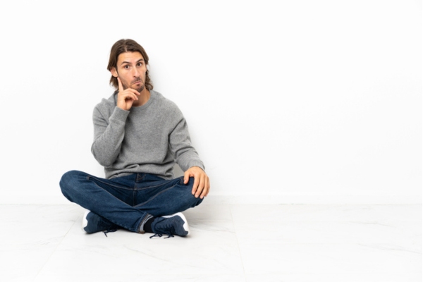 man sitting on the floor thinking Is Fireproof Insulation Possible