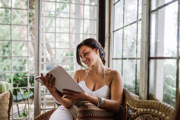 image of homeowner enjoying sunroom depicting sunroom insulation