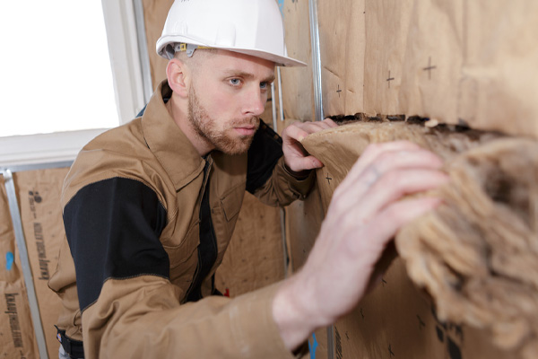 image of insulation contractors removing old attic insulation