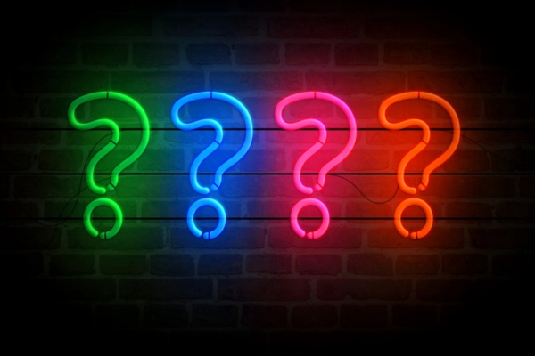 question mark formed using neon lights depicting Sunroom Insulation FAQs
