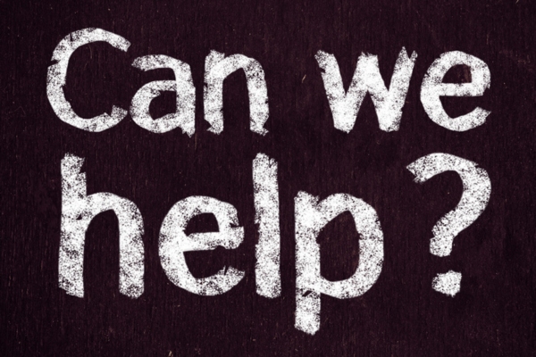 Can We Help written on a chalkboard