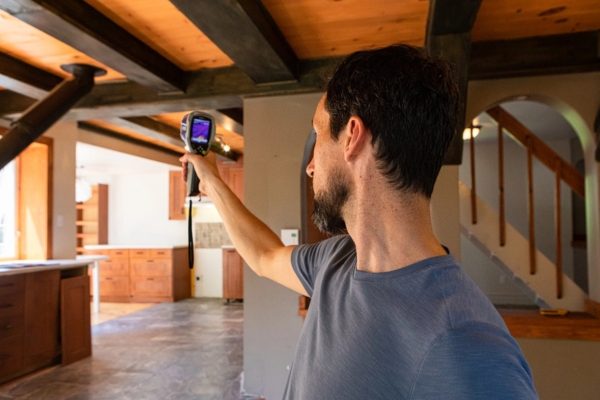 homeowner testing home heat transfer