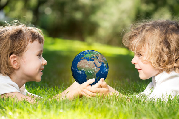kids holding planet depicting conservation of resources with insulation