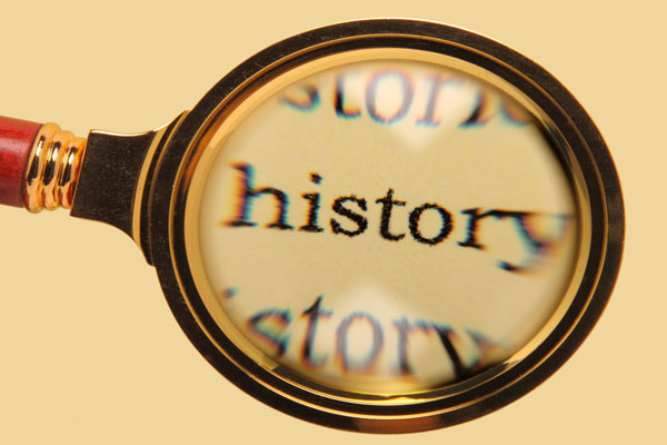 image of a magnifying glass and words history depicting history of insulation