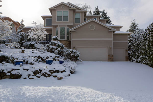 image of a home covered in snow that has proper winter insulation