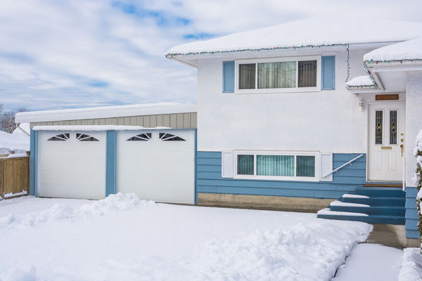 image of a garage shop and garage door in winter depicting insulation