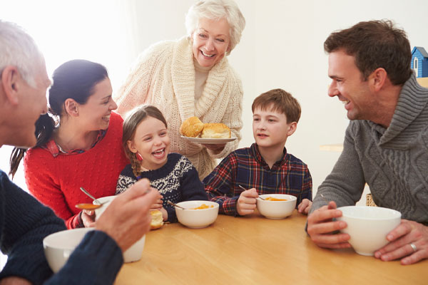 family at home in winter depicting comfort from insulation