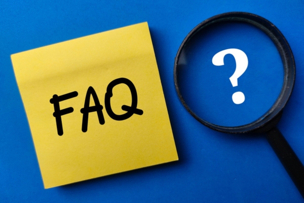 FAQ on a sticky note beside a magnifying glass depicting questions about Insulation in Older Homes