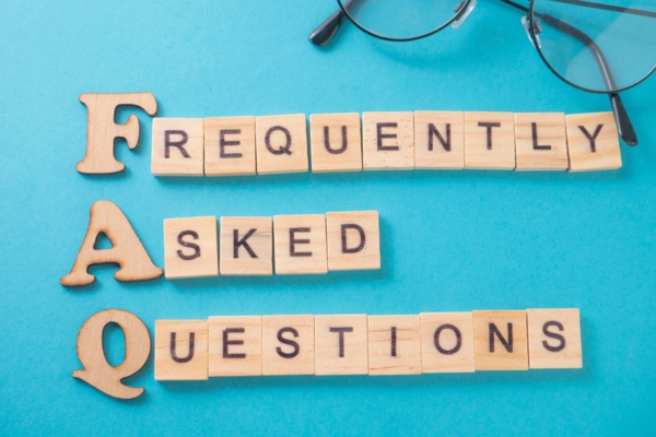 Frequently Asked Questions spelled using wooden letter tiles depicting FAQs about Attic Insulation and Heating Systems
