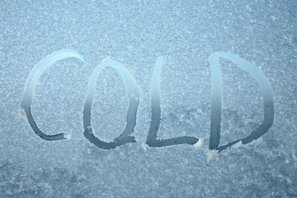 COLD written on a frozen window
