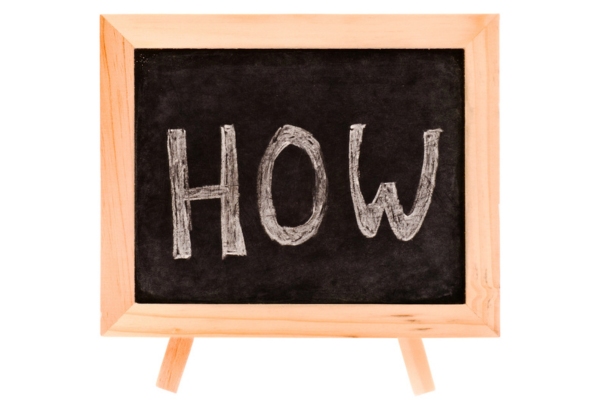 HOW written on a mini chalkboard depictingHow Ascend Construction Helps Improve Indoor Air Quality