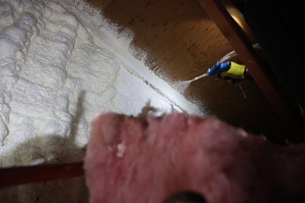 Ascend Construction spraying insulation