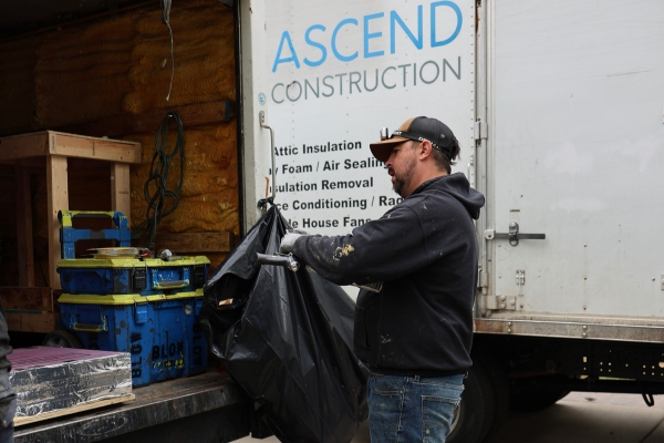 Ascend Construction van and employee