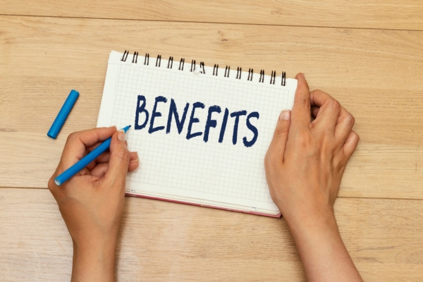BENEFITS written on a notebook depicting Attic Insulation