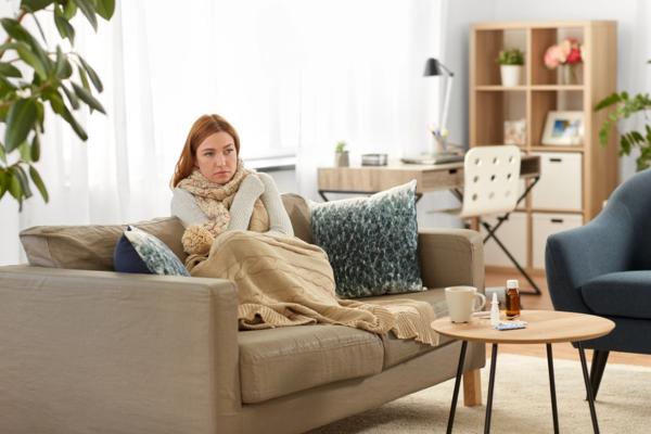 woman feeling cold indoors depicting Hot And Cold Spots In Your House